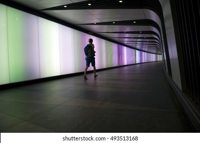 LONDON, 16 August 2016: Silhouette Of Man Walking At Kings Cross St Pancras Tube Station Walkway.