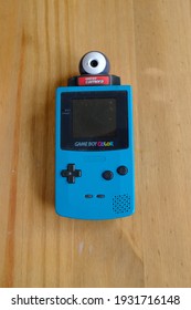 LONDON - 6TH MARCH 2021: The 1998 Nintendo Gameboy Color With The Game Boy Camera Cartridge. 