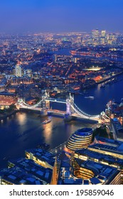 London aerial view panorama at night with urban architectures and Tower Bridge.