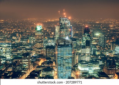 London Aerial View Panorama At Night With Urban Architectures.