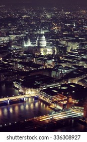 London Aerial View Panorama At Night With Urban Architectures.