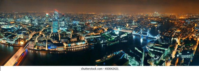 London aerial view panorama at night with urban architectures and tower bridge.