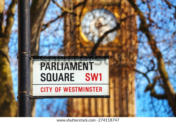 LONDON - APRIL 12:\
Parliament square sign in city of Westminster on April 12, 2015 in\
London, UK. It\'s a square at the northwest end of the Palace of\
Westminster in London.