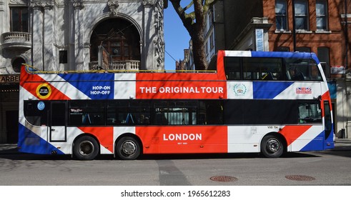 LONDON - APRIL 17, 2021. A Large Open Top London Site Seeing Tourist Bus In Charing Cross Road, Central London, UK.