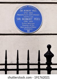 LONDON - APRIL 26. A Commemorative Wall Plaque On April 26, 2014, For Robert Peel And His Son Prime Minister And Founder Of The Metropolitan Police On Their House At 16 Grosvenor Street, London, UK.