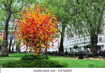 LONDON - APRIL 26. The Sun glass sculpture by USA artist Dale Chihuly stands 18 feet (5.5metres) high with over 1300 hand-blown elements, on display on April 26, 2014 in Berkeley Square, London, UK.