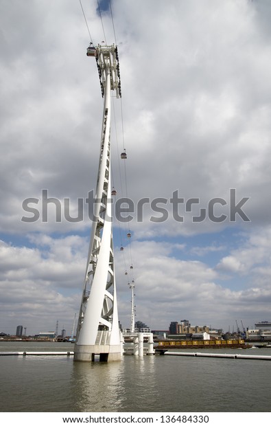 LONDON - APRIL 6: The
Emirates Air Line cable in East London on April 6, 2013 which has
carried over two million passengers and celebrates it's first year
in June 2013