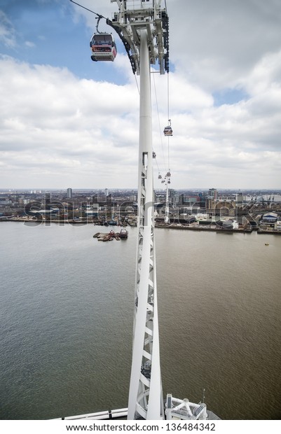 LONDON - APRIL 6: The\
Emirates Air Line cable in East London on April 6, 2013 which has\
carried over two million passengers and celebrates it\'s first year\
in June 2013