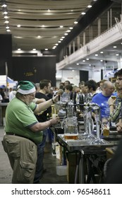 LONDON - AUG 05: Brewers Of Great British Beer Festival, 2010, At Earls Court, Britain's Biggest Beer Festival On Aug 05, 2010 In London, UK. Visitors Can Try Wide Range Of Real Ales, Ciders, Perries.