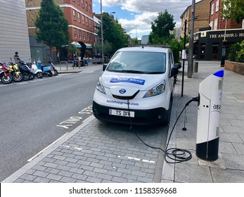 LONDON - AUGUST 17, 2018: A Commerical Electric Vehicle Van Uses A Charging Station In London, UK.