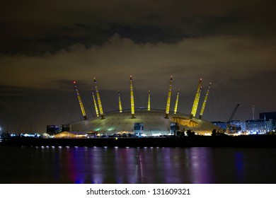 LONDON - AUGUST 6: Night illumination of Millennium Dome, also called O2 Arena, in the distance across the river Thames during the Olympic Games time in London, August 6, 2012.