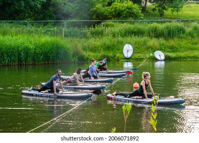 London, Beckenham, United Kingdom - June 23, 2021: Beckenham Place Park swimming lake, a popular place for wild swimming and SUP yoga classes
