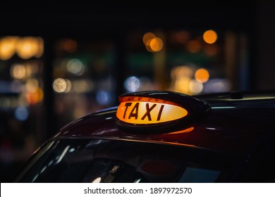 London Black Cab Taxi Sign At Night