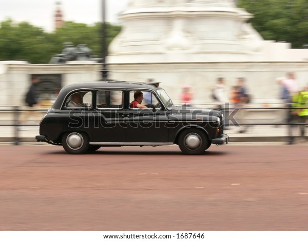 London black taxi in\
motion