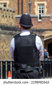 London bobby. English policeman from behind in a street of London UK