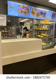 London Canada, December 26 2020: Editorial Photograph Of The Front Of A McDonald’s Ordering Counter Showing The Plexiglass Barrier For Covid Safety.