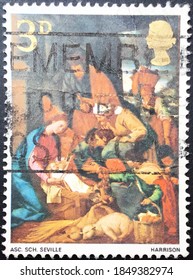 London, circa 1967: Used English postage stamp dedicated to Christmas depicting The Adoration of the Shepherds.