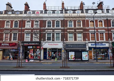 LONDON CITY - DECEMBER 25, 2016: Row Of Small Shops In The Ground Floor Of A Row Of Town Houses On Holland Park Avenue