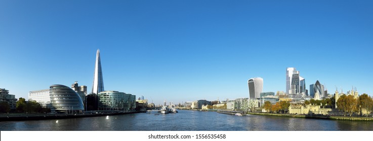 London City Skyline Panorama Across River Thames Against Clear Blue Sky