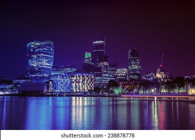 London City Skyline From The River Thames By Night