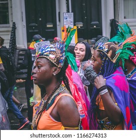 London, London City / United Kingdom - August 26, 2018: Notting Hill Carnival 2018. Carribean People Are​ Dancing In The Rain. Second Largest Carnival In The World.