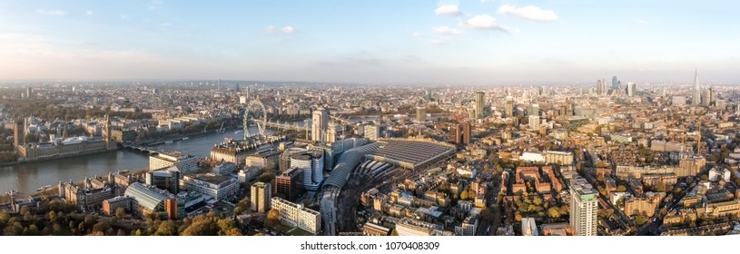 London Cityscape Aerial Panorama View feat. Houses of Parliament in Westminster on Thames River, Famous British Landmarks Skyline with Wide Panoramic Birds Eye View in England, United Kingdom UK