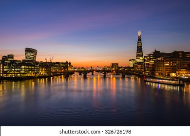 London Cityscape During Sunrise - River Thames With Silhouettes Of Modern Skyscrapers