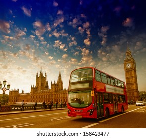 London. Classic Red Double Decker Bus Crossing Westminster Bridge At Sunset.