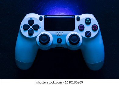 LONDON - DECEMBER 12, 2019: Video game gaming controller night with lights dark background top view