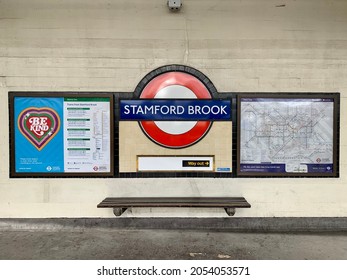 LONDON, ENGLAND - 04.10.2021. Stamford Brook underground station logo on platform. A District line tube station in West London. London Underground map on a side. Horizontal. Selective focus
