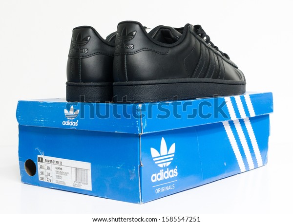 black adidas superstar trainers