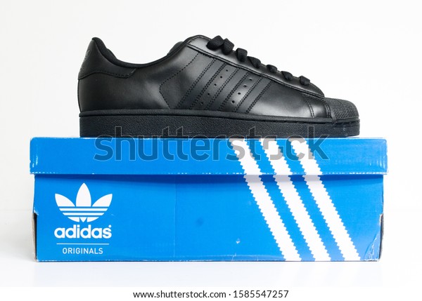 black adidas superstar trainers