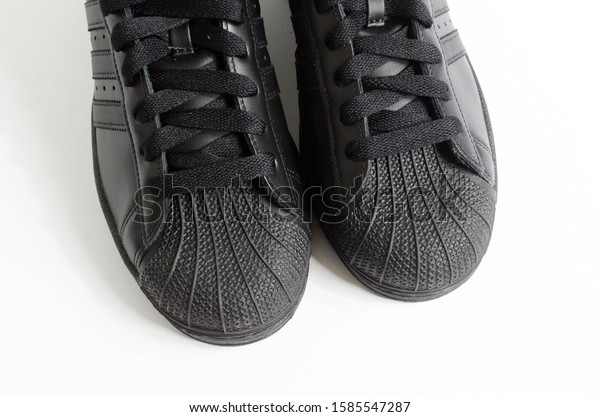 all black adidas shell toes
