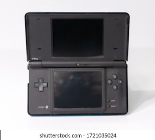 London, England, 05/05/2019 A Metallic  Blue Nintendo Ds Dsi Hand Held Vintage Console On A White Studio Background. Retro Video Gaming Handset. Nostalgic Computer And Arcade Games Family Fun