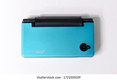 London, England, 05/05/2019 A Metallic  Blue Nintendo Ds Dsi Hand Held Vintage Console On A White Studio Background. Retro Video Gaming Handset. Nostalgic Computer And Arcade Games Family Fun