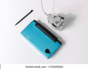 London, England, 05/05/2019 A Metallic  Blue Nintendo Ds Dsi Hand Held Vintage Console On A White Studio Background. Retro Video Gaming Handset. Nostalgic Computer And Arcade Games Family Fun