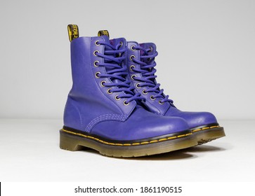 london, england, 05.05.2019 purple and lilac Dr Martens 1460 white Leather Boots 8 Eye lace hole. fashionable punk historic british made leather boots. dr martens air war with bonding soles. 