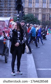 London/ London/ England - 09/09/2019: Streets Of London. A Woman Taking A Selfie In The Middle Of The Crowd. Popular, Tungsten, Psychology, Freud, Psychiatrist, Instagram, Facebook. Capitalism Travel