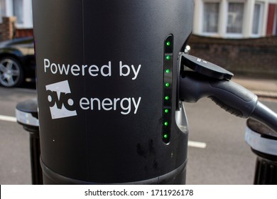 
London, England - ‎April 13 ‎2020: Close up of an electric vehicle recharging point in a residential road with ovo energy logo.