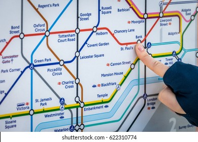 London, England -  25 March 2017 : Boy pointing at the Tube Map in London