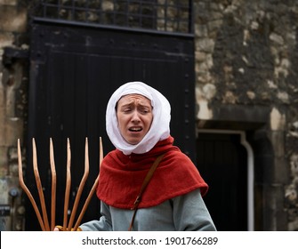 London England; 30,08,2015: Representation Of A Peasant Woman With A Wooden Rake In A People's Revolt In The Tower Of London