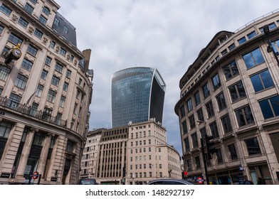 London, England - 9 June 2019: Fantastic classic architecture in City of London with skyscrapers in background. New versus old architecture. Classic and modern facade. 20 Fenchurch Street in London 