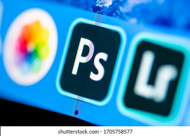 London, England Apr 16 2020: Photos, Adobe Photoshop & Adobe Lightroom apps on a desktop with pixels