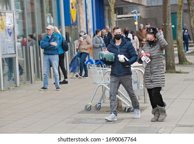 London, England. April 1st, 2020. People out shopping in South London during the Coronavirus pandemic. Wearing protective mask and practising social distancing.