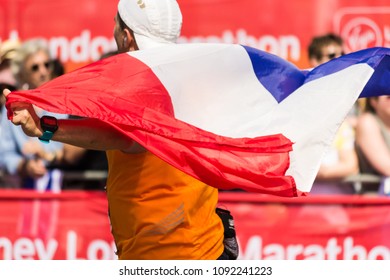 London, England - April 22 2018: Marathon Runner Holding The French Flag