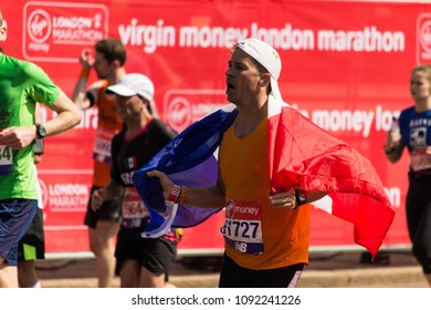 London, England - April 22 2018: Marathon Runner Holding The French Flag