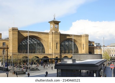 London, England - April 30, 2016: Kings Cross Railway Station London, a major London railway terminus basks in the afternoon sun. In the foreground, the new entrance to Kings Cross underground, on the