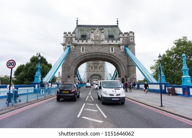 London, England - August 12th 2015: Tower Bridge In London With People And Traffic.  Looking Straight Down Centre Of Bridge.