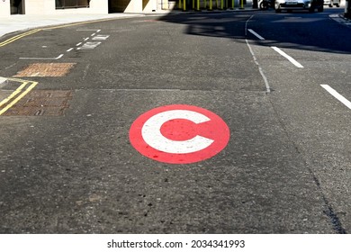 London, England - August 2021: Symbol Painted On A Road In Central London To Mark The Traffic Congestion Charge Zone.