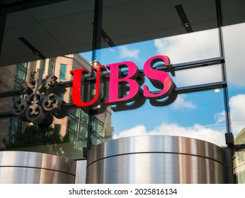 London, England, August 2021: UBS UK Head Office, 5 Broadgate Circle, London, EC2M 2QS. The Red UBS Logo Sign Above The Main Entrance. Provides Financial Services. 